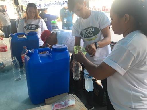 NutriAsia Employees refilling bottles